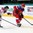 MINSK, BELARUS - MAY 17: Russia's Nikita Kalinin #40 plays the puck while Latvia's Rodrigo Lavins #2 defends during preliminary round action at the 2014 IIHF Ice Hockey World Championship. (Photo by Andre Ringuette/HHOF-IIHF Images)


